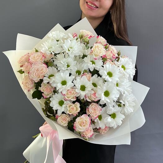 A magnificent bouquet of delicate bush roses and chamomile chrysanthemums