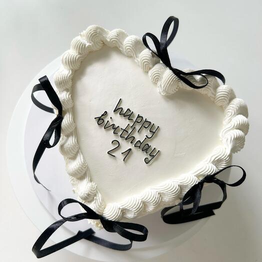 Lambeth Cake with black bows and ruffles