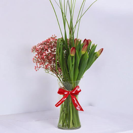 Vibrant Delight: Red Tulips and Gypsophilia in a Cylinder Vase