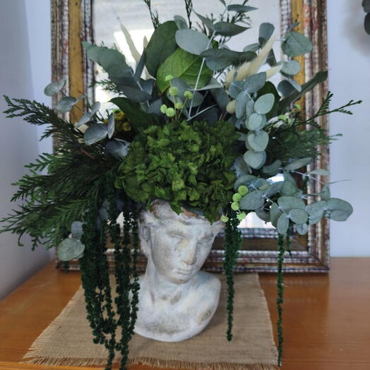 Jarron cabeza decorado con flor preservada y seca