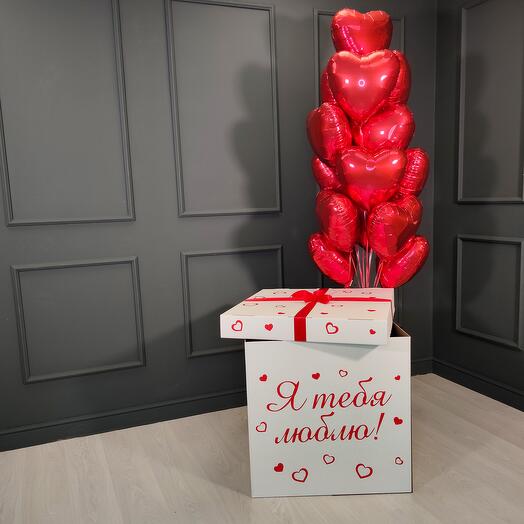Foil-wrapped red hearts in a white box