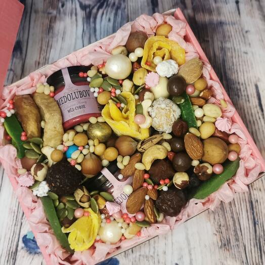 A box of nuts, dried fruits, honey "Yummy"