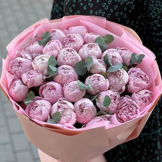 Bouquet of pink peonies and eucalyptus