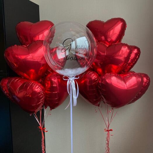 A set of balls. The balls of the heart are red. Helium balloons