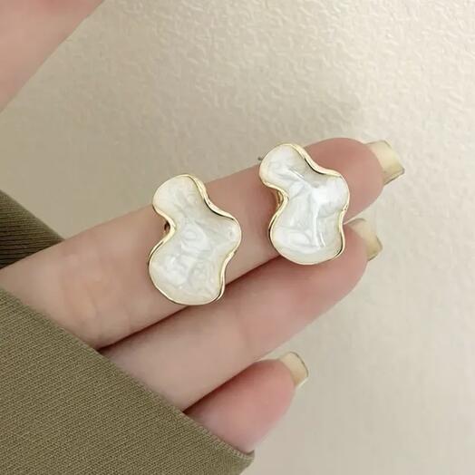 Stud earrings are white