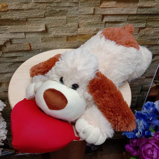 A soft toy dog with a heart