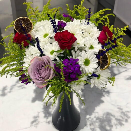 Daisies and Roses in The Black Vase