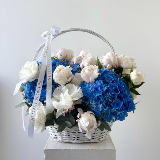 Blue hydrangeas with White peonies in a basket