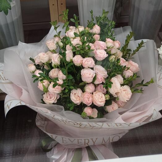 Bouquet of bush roses and greenery