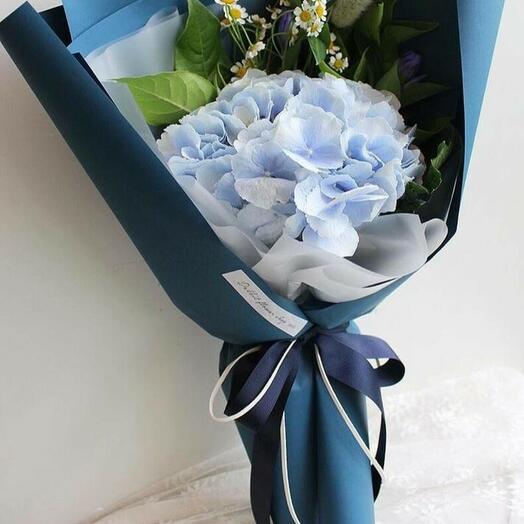 Bouquet of hydrangeas with greenery