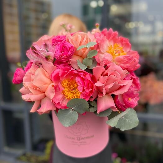 Peonies and a peony-shaped rose in a box
