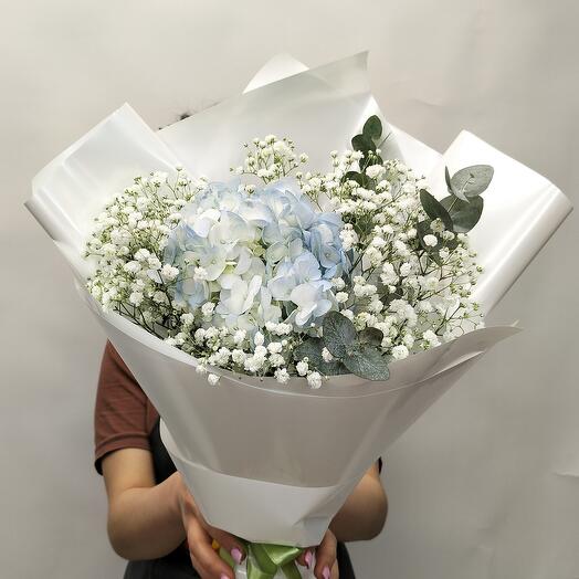 Bouquet with blue hydrangea and gypsophila "Snow White