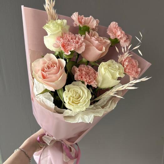A compliment bouquet of roses and dianthuses