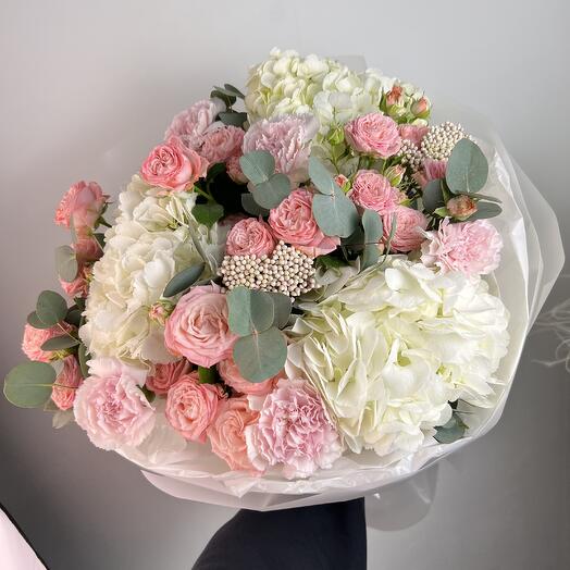 Delicate white hydrangeas with pink peony-style roses and dianthus