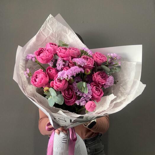 Bouquet of bright pink peony-shaped bush roses