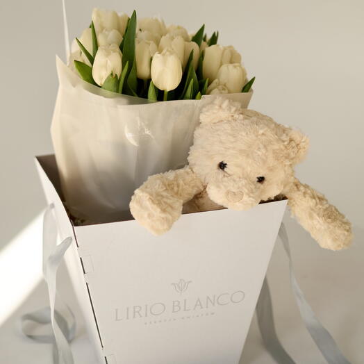 White tulips with a soft toy