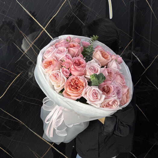 Bouquet of peony-like and spray roses