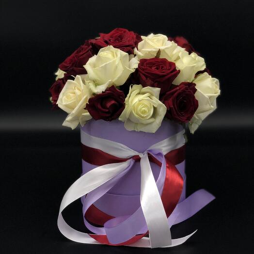 25 red and white roses in a hatbox