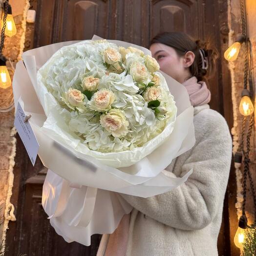 Bouquet of delicate white hydrangea and bush rose