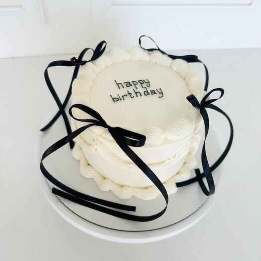 Lambeth cake with black bows and ruffles for 6-8 guests