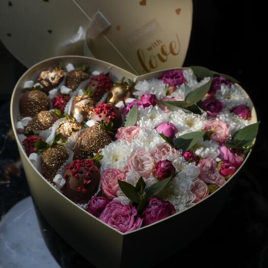 Fresh flowers in a box and chocolate-covered strawberries