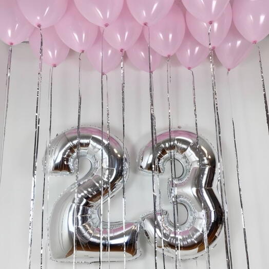 Balloons numbers and pink helium balloons in the ceiling