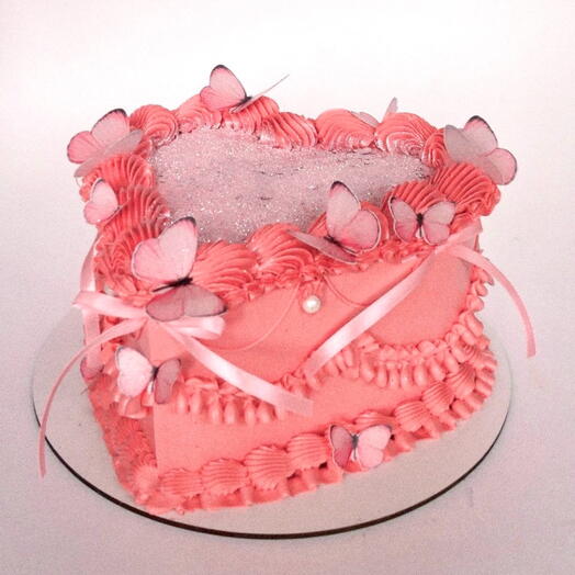 Торт в виде сердца 1,5кг в стиле ламбет с бабочками и бантиками розовый