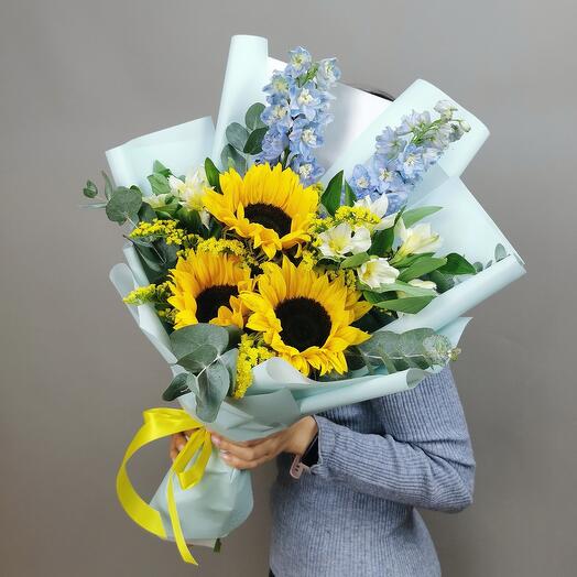Author's bouquet with sunflowers and delphinium