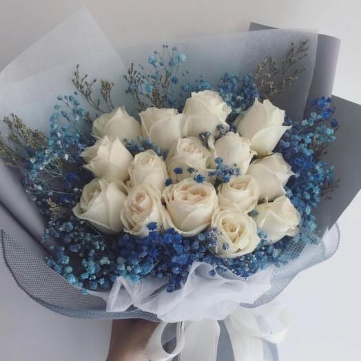 Bouquet of white roses and blue gypsophila