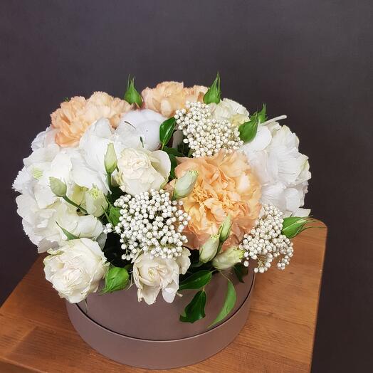 Flowers in a box. White eustoma and hydrangea, peach dianthus