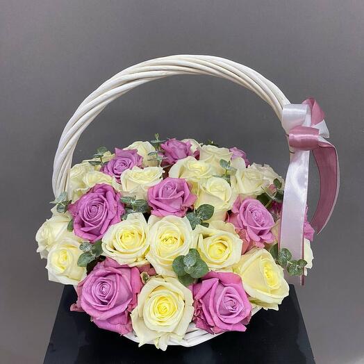 Basket with 19 roses and eucalyptus