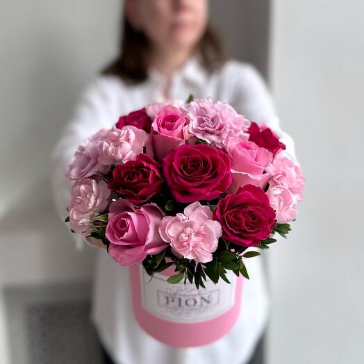Flowers in a box with pink roses