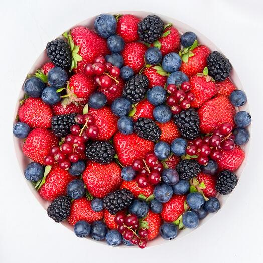 Strawberries and berries in a gift box