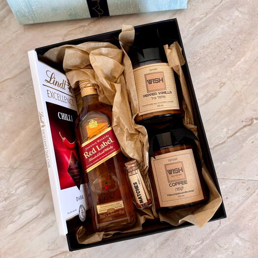 Gift box with chocolate, whisky and candles