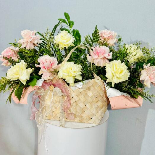 Wicker basket with flowers and French roses