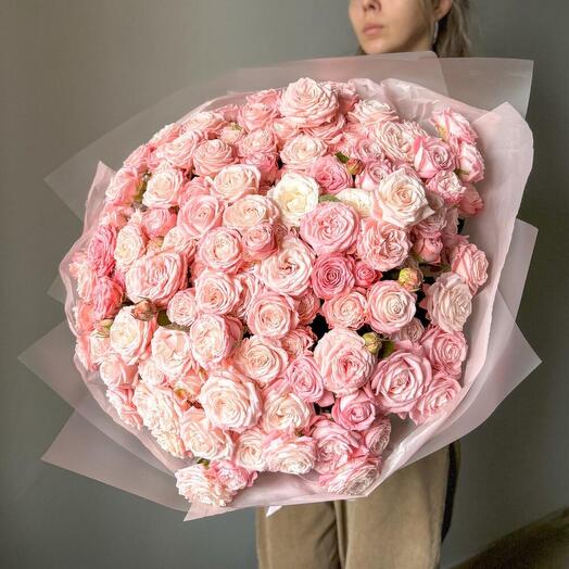A large bouquet of pink peony-shaped roses