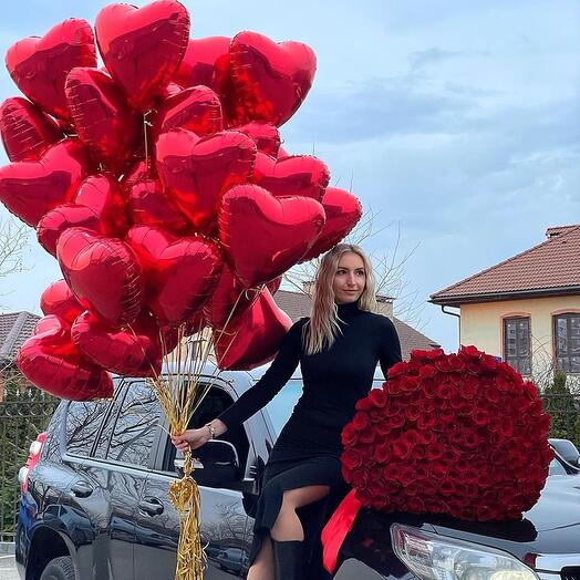 Helium balloons and red roses