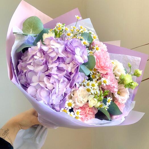 A blooming garden, an author's bouquet with hydrangeas, eustoma, in a beautiful delicate package to lift the mood