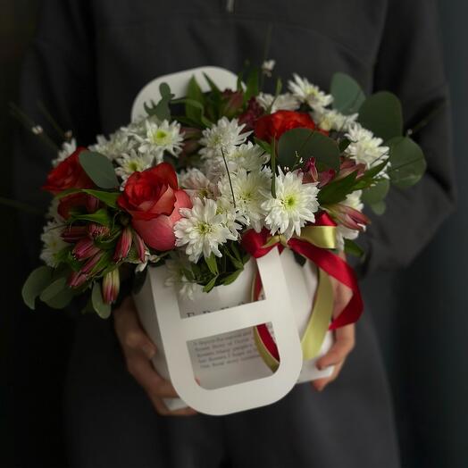 Flowers in a handbag with roses and chrysanthemum