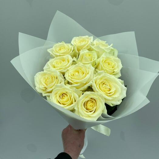 Classic bouquet of white roses in a white package