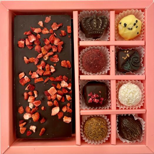 A set of chocolates with chocolate bars with raspberries