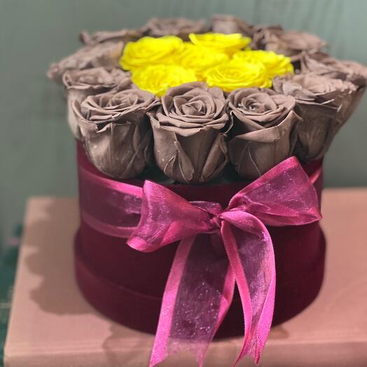 Yellow and brown roses in a box