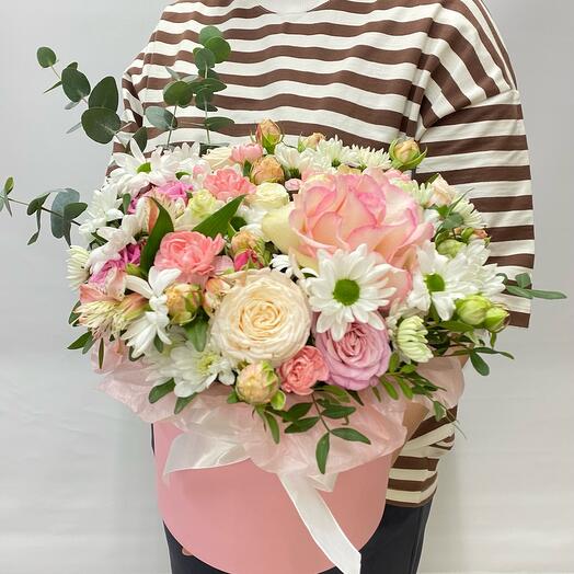 A composition of French roses, chrysanthemums and a peony-shaped bush rose