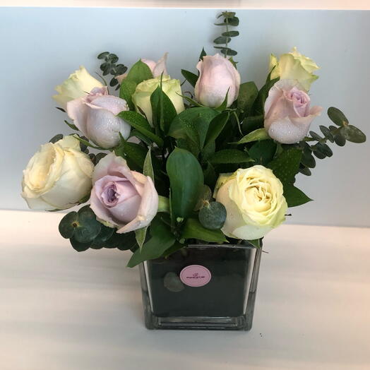 White and light purple roses in vase