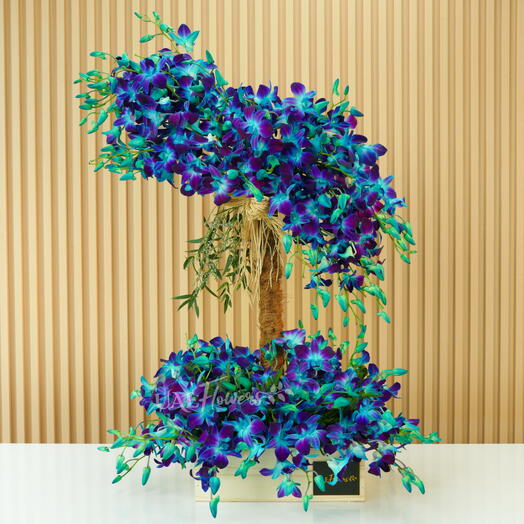 Tower Arrangement Of Blue Orchids