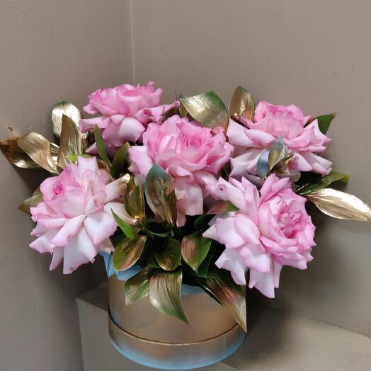 French pink roses with golden leaves in a hatbox. Exclusive