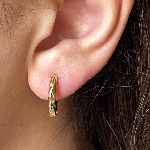 The earrings are wrinkled
