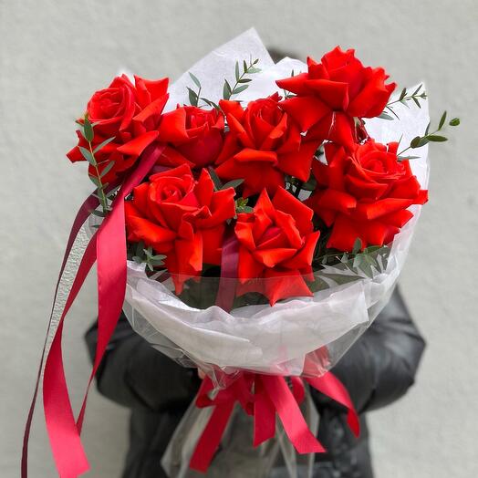 A bouquet of 7 Ecuadorian Nina roses with eucalyptus twigs in a classic package