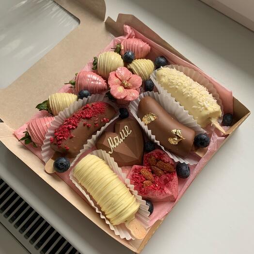 A set of assorted chocolate-covered strawberries and bananas