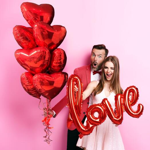 Helium balloons red hearts and the word Love